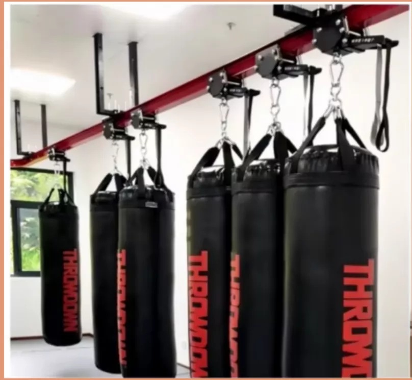 Wall-mounted heavy bag stand with steel bracket and end stopper plates